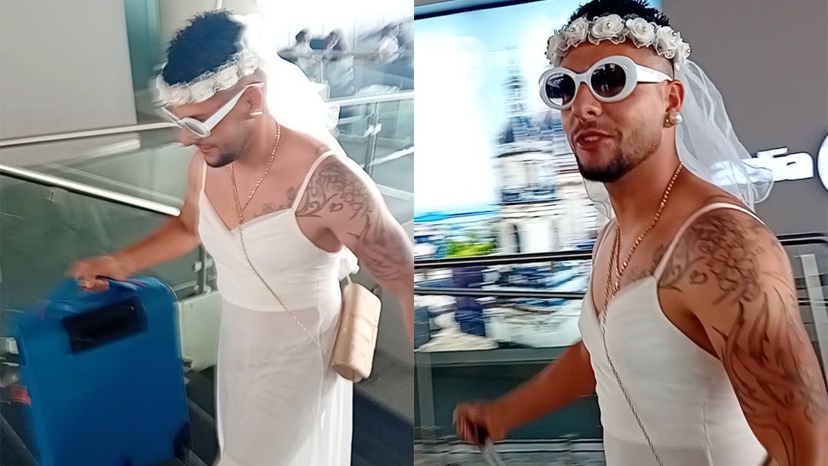 Man loopt in trouwjurk op vliegveld Catania