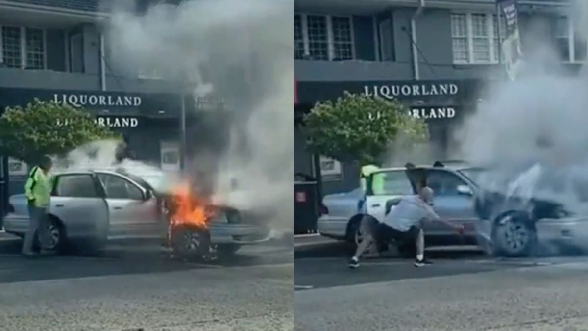 Aussie negeert autobrand tijdens het inladen van een doos bier