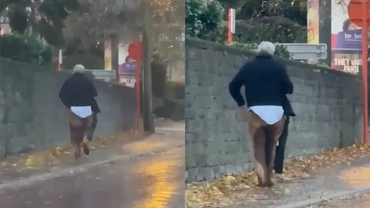 thumb_vk_Burgemeester_van_Sint_Truiden_loopt_laveloos_door_de_straat_met_natte_broek_en_al