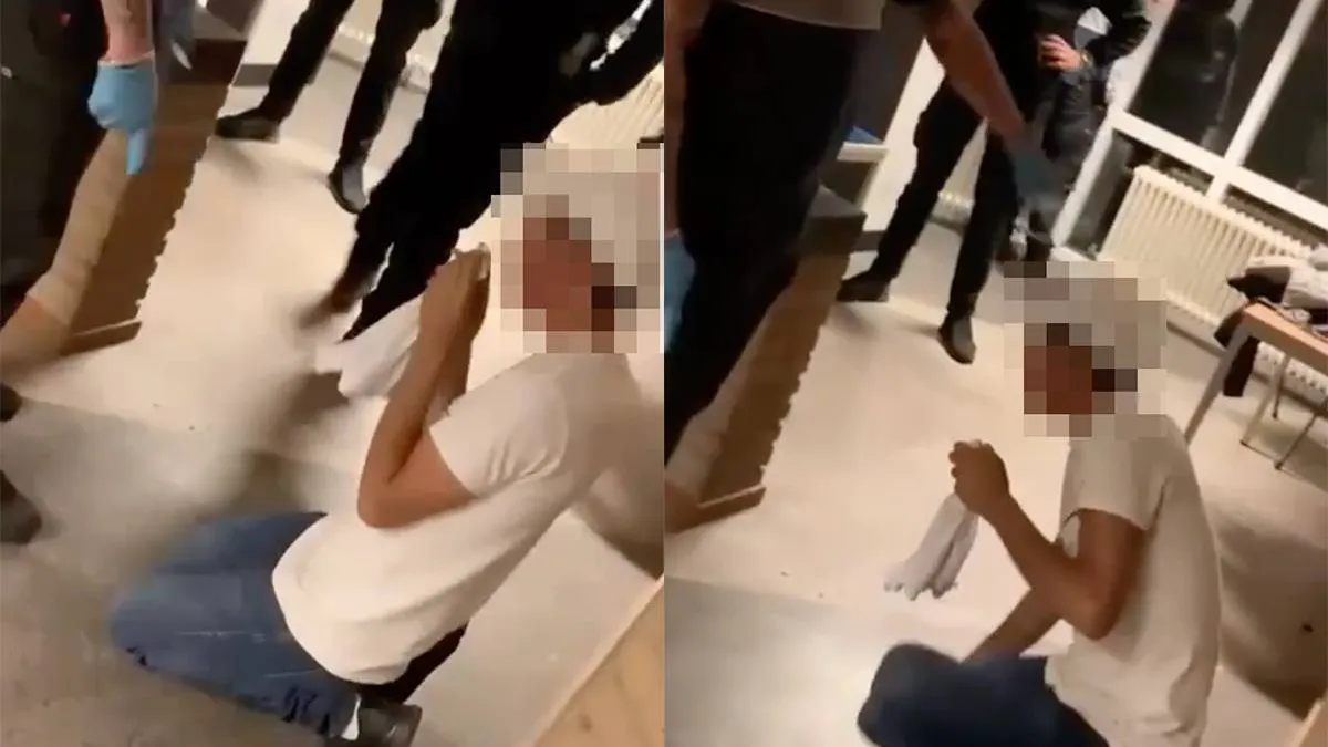 thumb_vk_Beveiliger_azc_Budel_liet_asielzoeker_zijn_schoenen_kussen_oud_filmpje_duikt_opnieuw_op