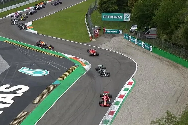 Vettel leads into the first chicane at Monza
