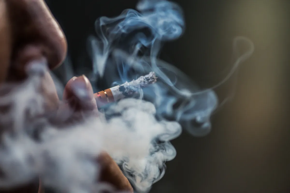 closeup shot person puffing cigarette surrounded with smoke 181624 18720