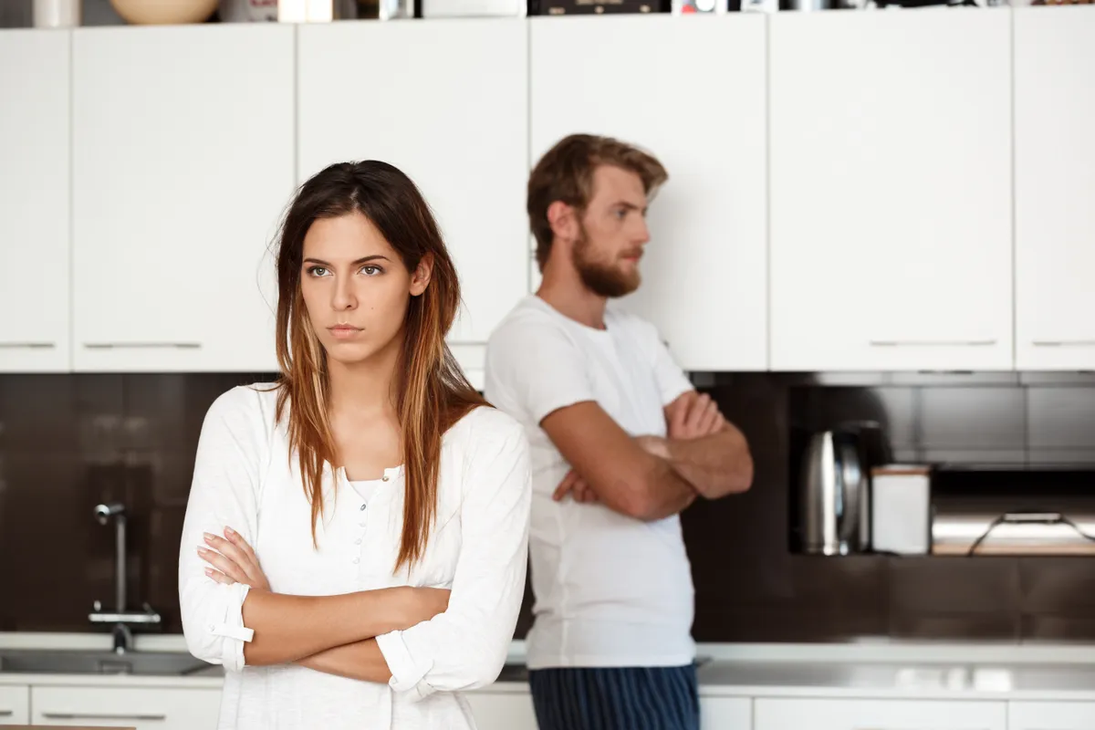 displeased beautiful brunette girl quarrel with her boyfriend