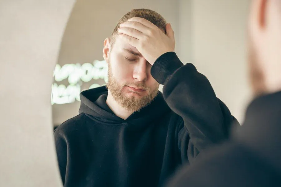 sad young man with beard front mirror mental health concept 169016 27561