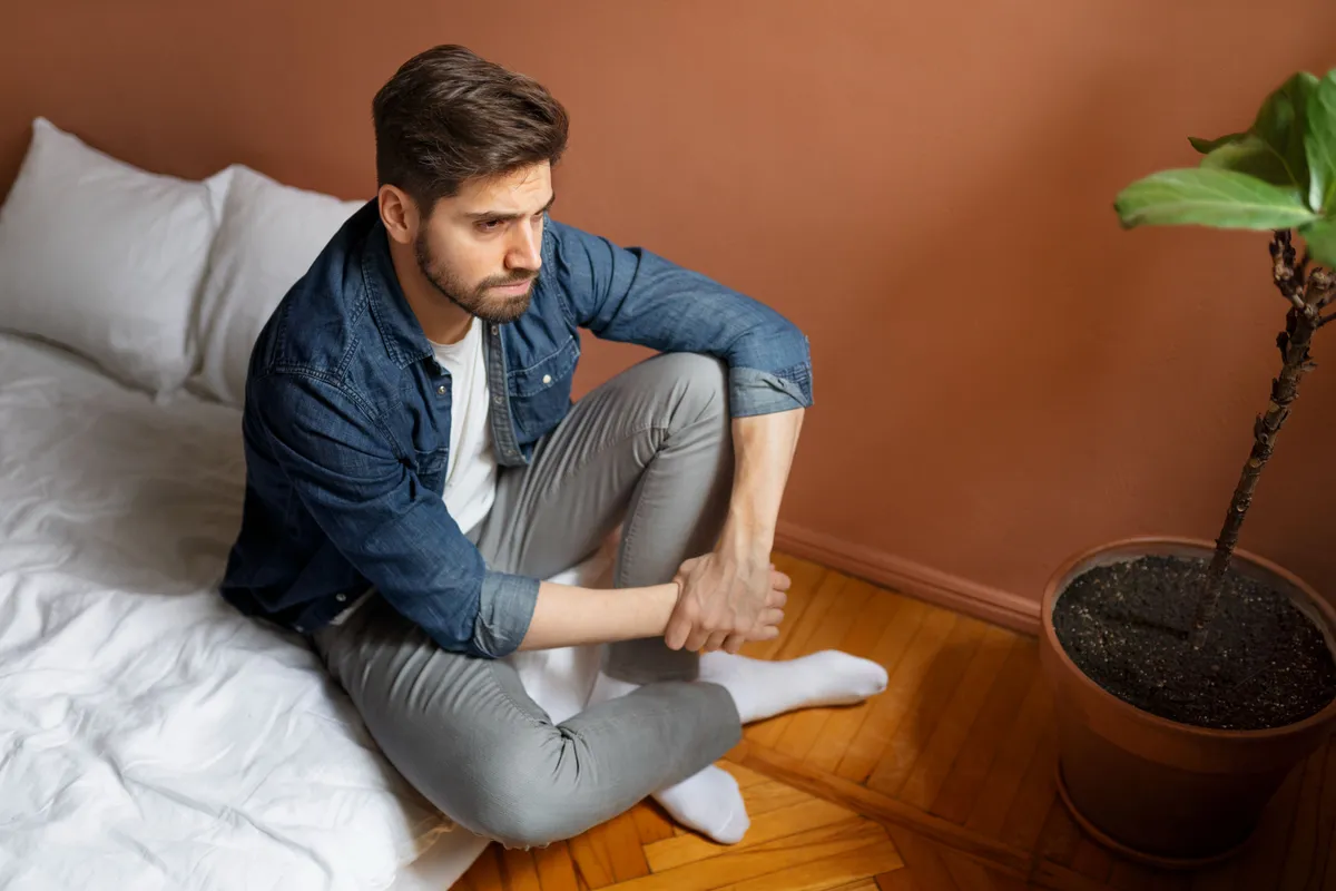 high angle insecure man indoors