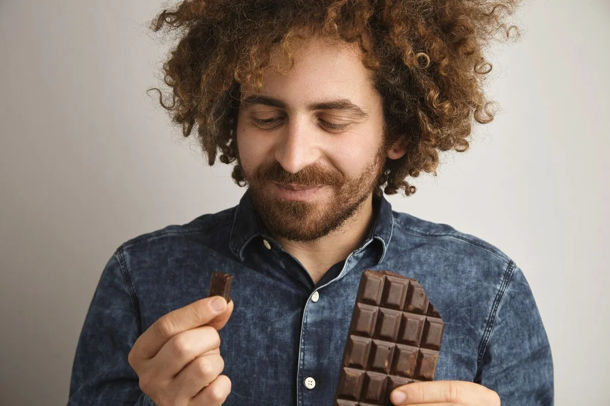 young happy bearded man with healthy skin curly hair pleasured with taste organic freshly baked chocolate bar 346278 883