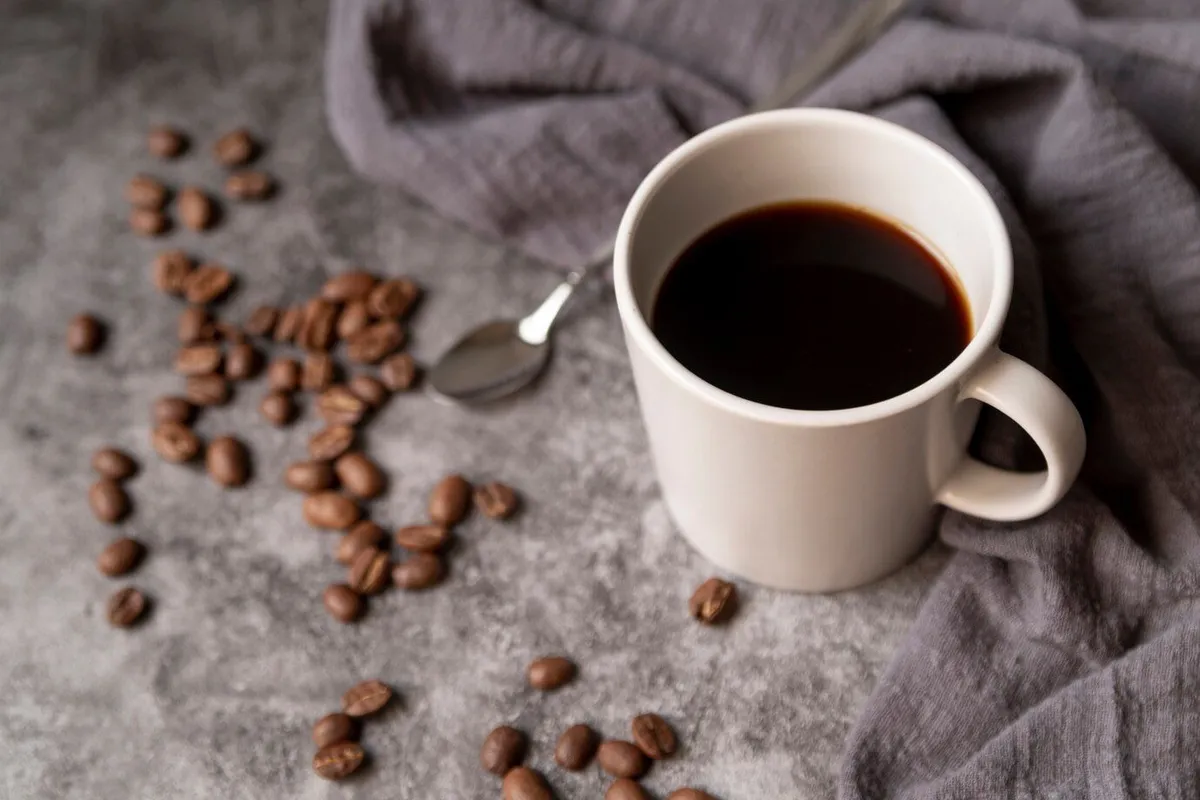 cup coffee with coffee beans spoon 23 2148255059