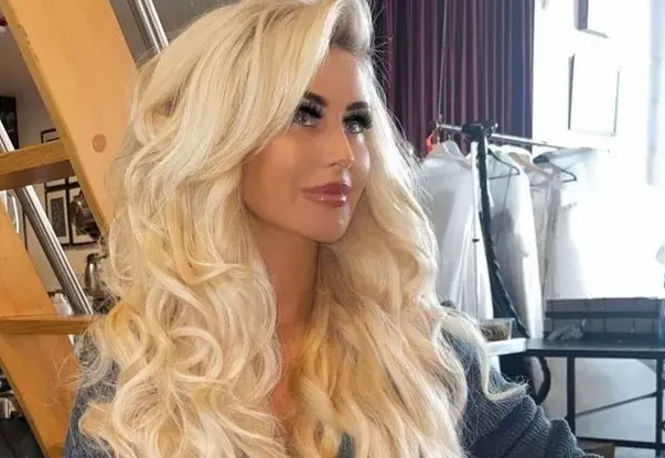0 ex wag and playboy model helps disabled fan by covering up her assets and sexy lingerie