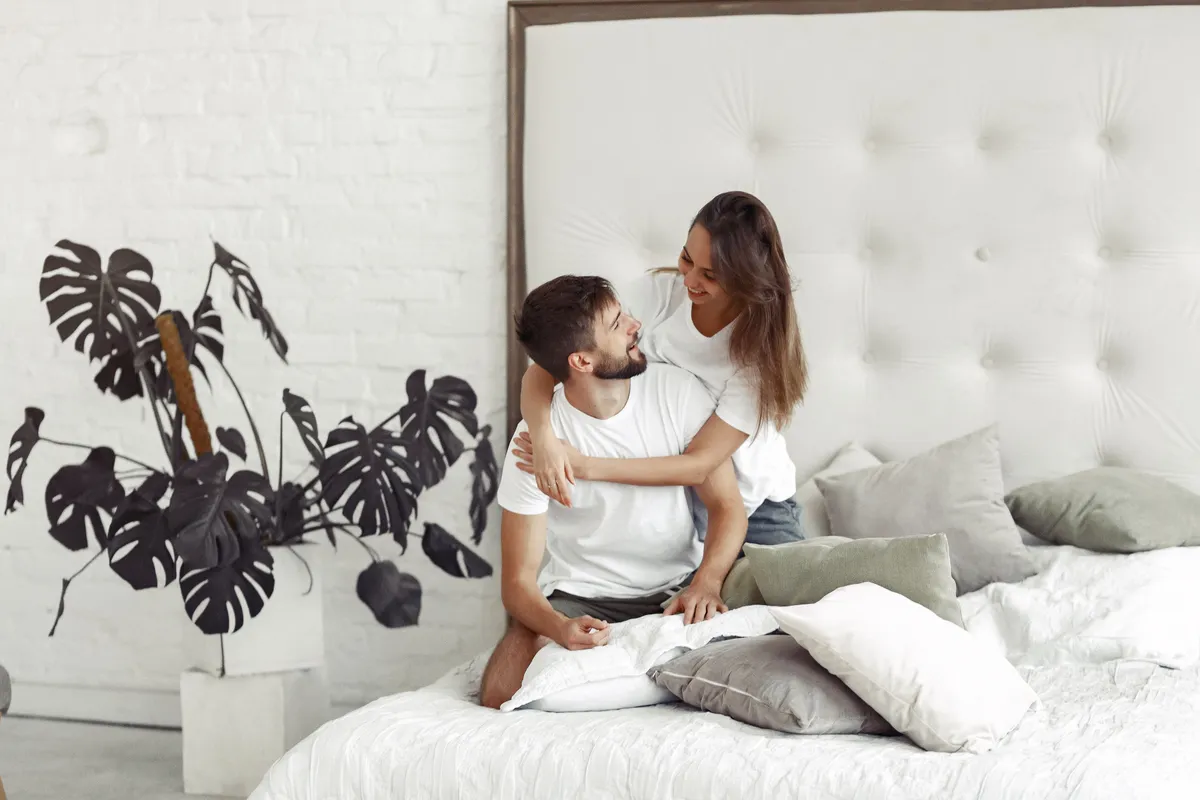 couple sitting bed room
