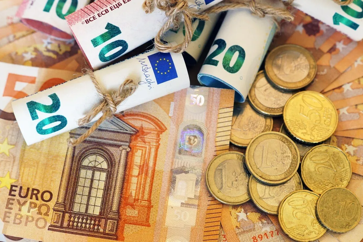 high angle view some rolled banknotes coins more banknotes 181624 17842
