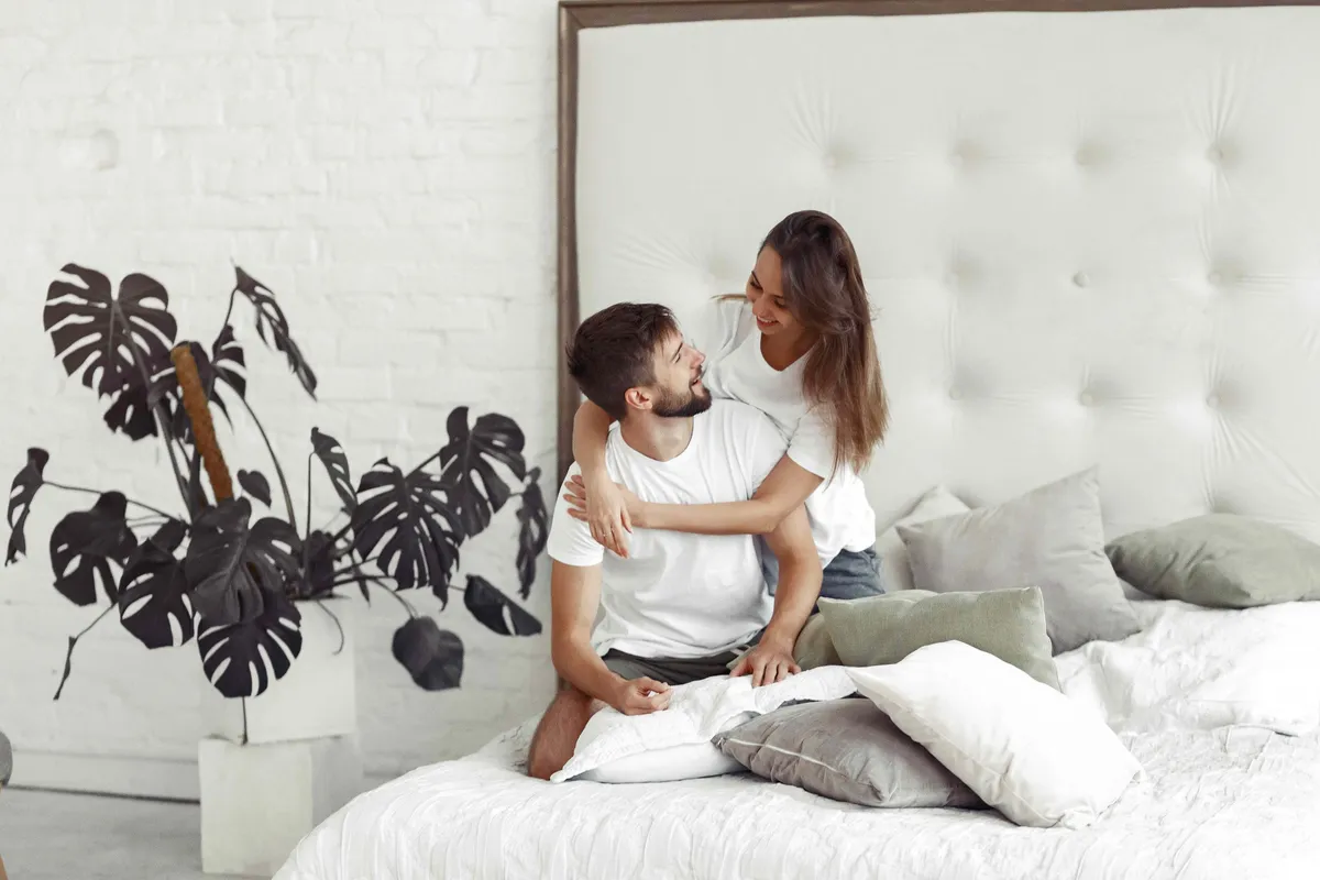 couple sitting bed room