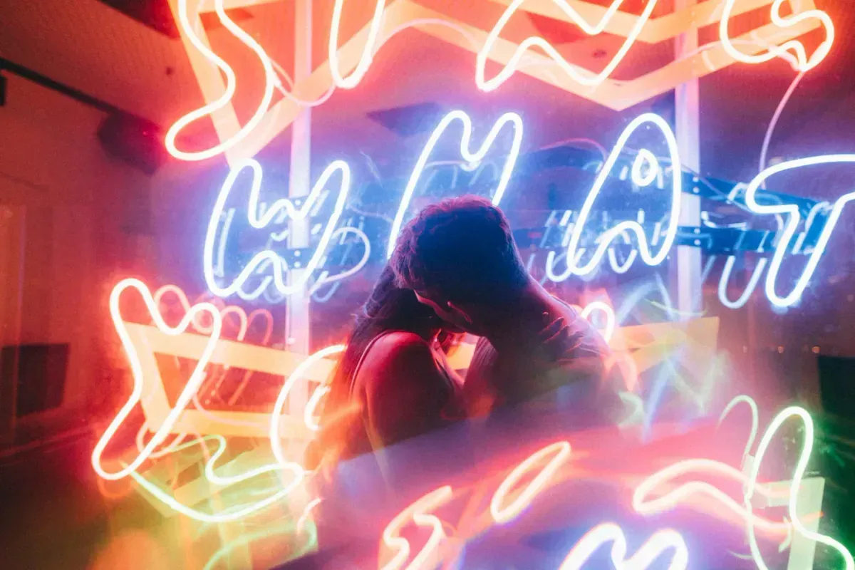 beautiful couple loving each other surrounded by neon lights shot with slow shutter 181624 1691 653685c2708bc 65894063722ec