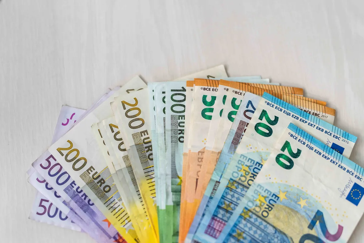 colorful euro banknotes fan wooden table