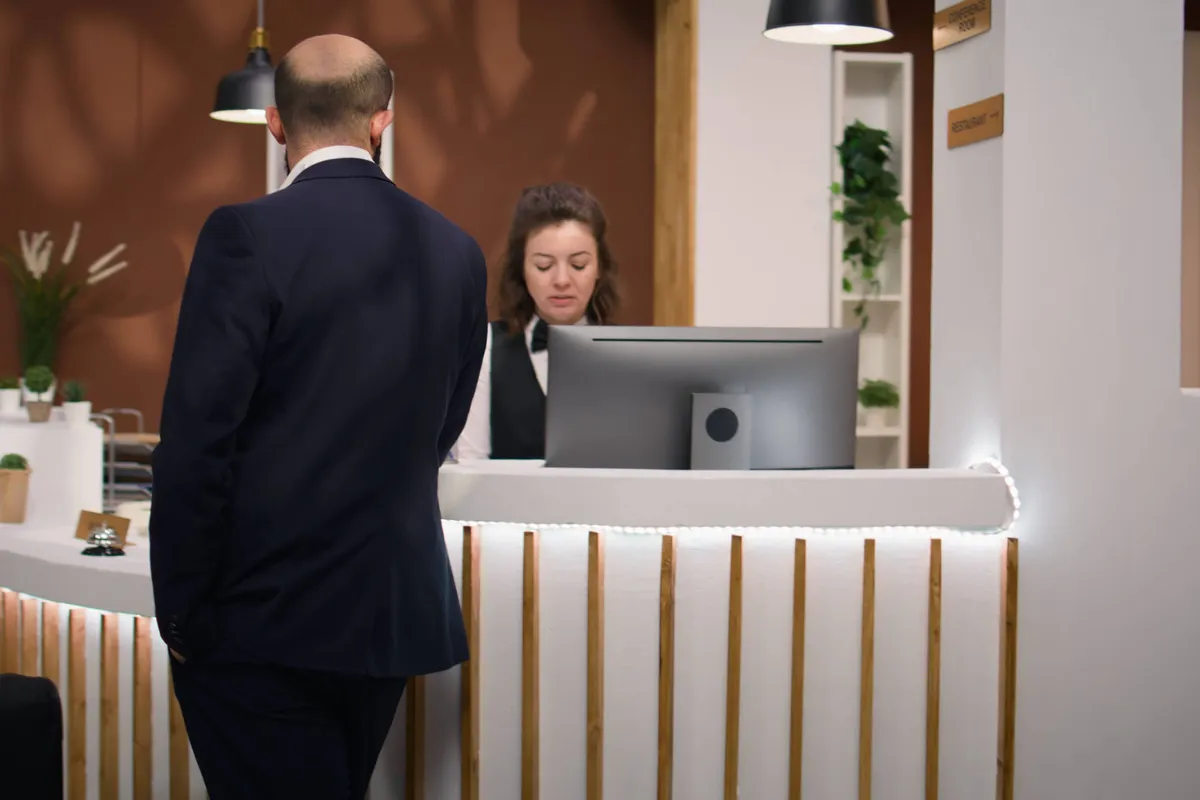 businessman talks staff member