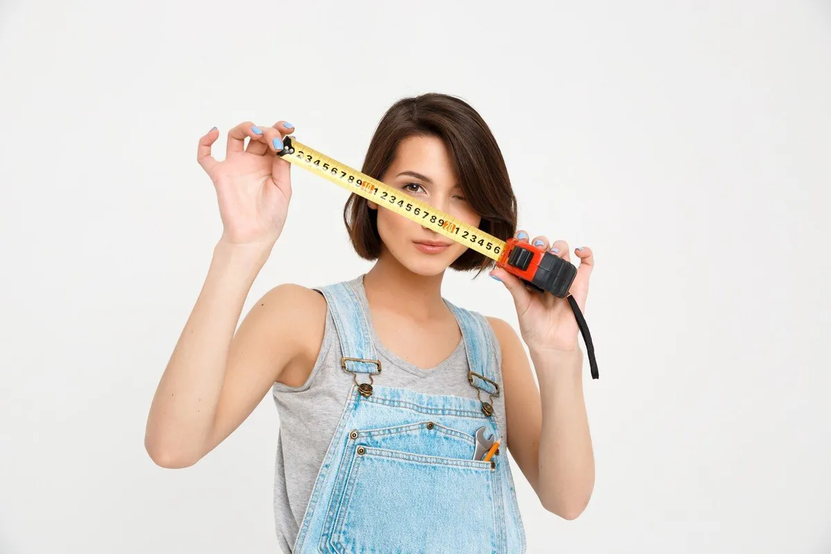 cute woman with tape measure renovate house 176420 16364