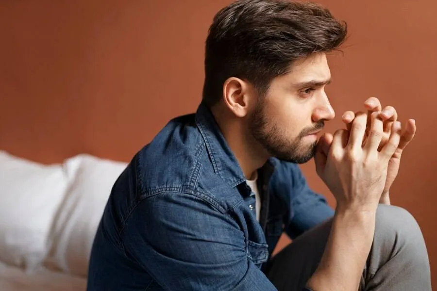 insecure man indoors side view 23 2149837699