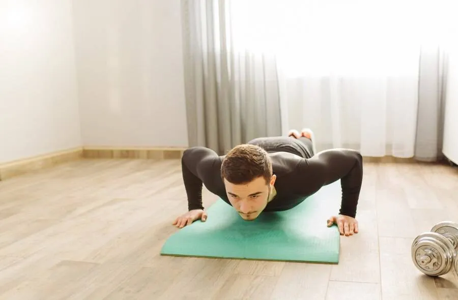 young man making sport exercises home 1328 3050