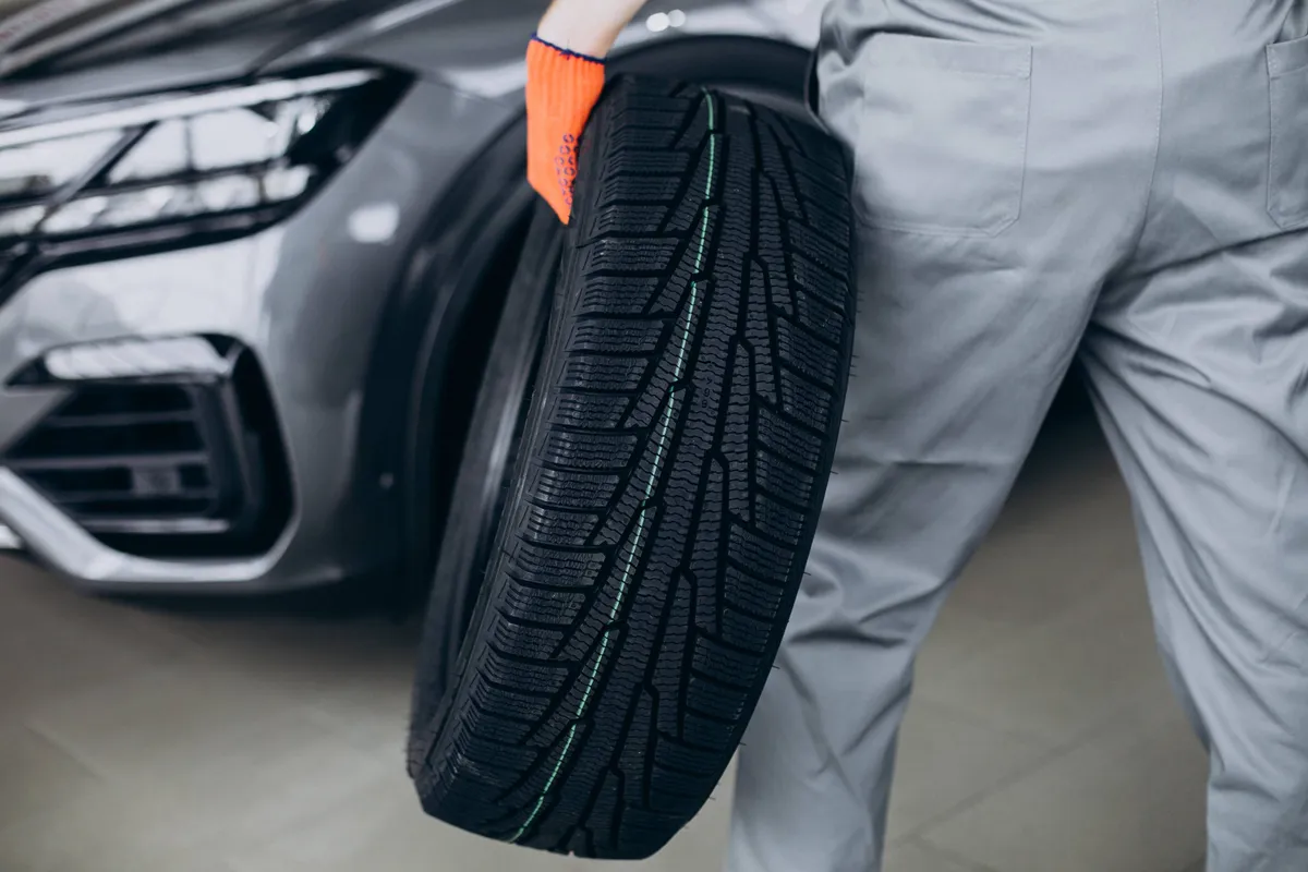 mechanic changing tires car service