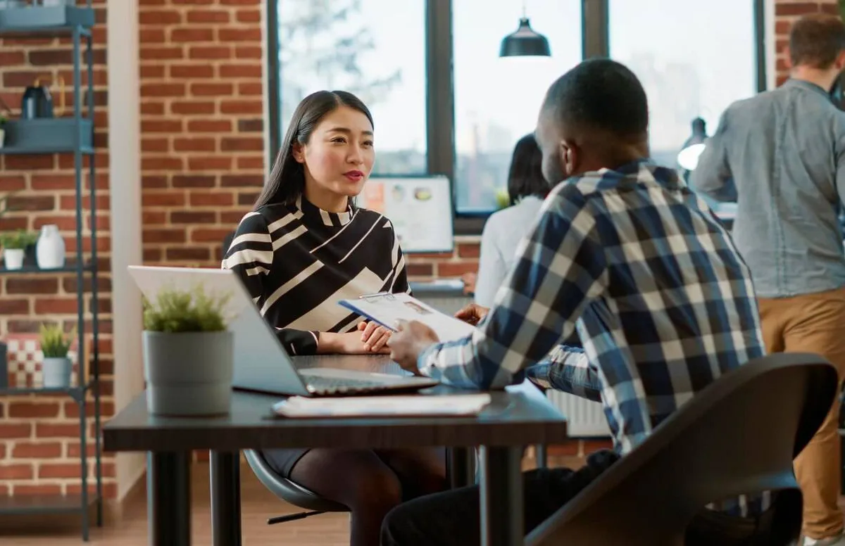 male recruiter interviewing job seeker about work experience making employment offer man woman meeting discuss about hr recruitment analyzing resume information hire 482257 43241