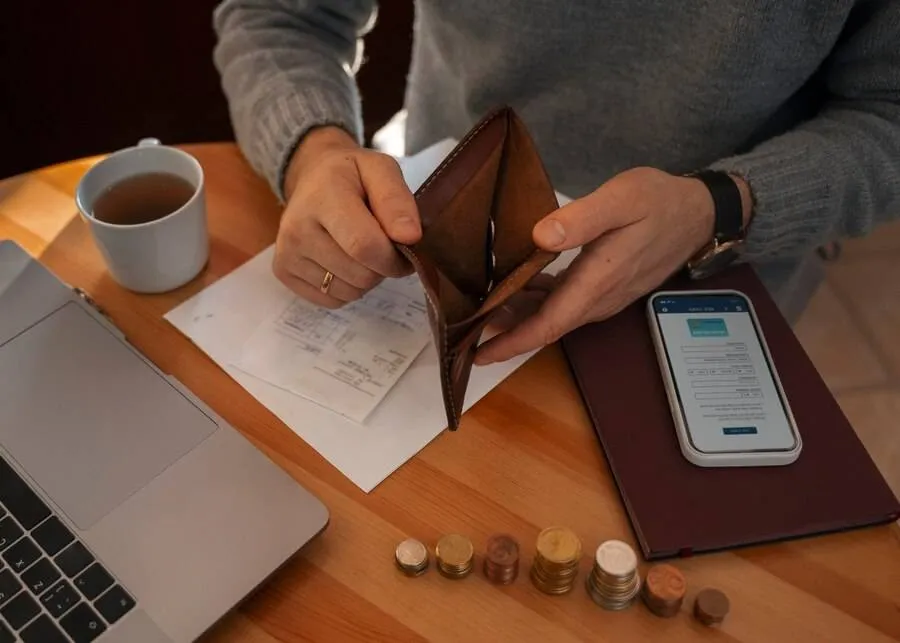 man saving money energy crisis 23 2150061852