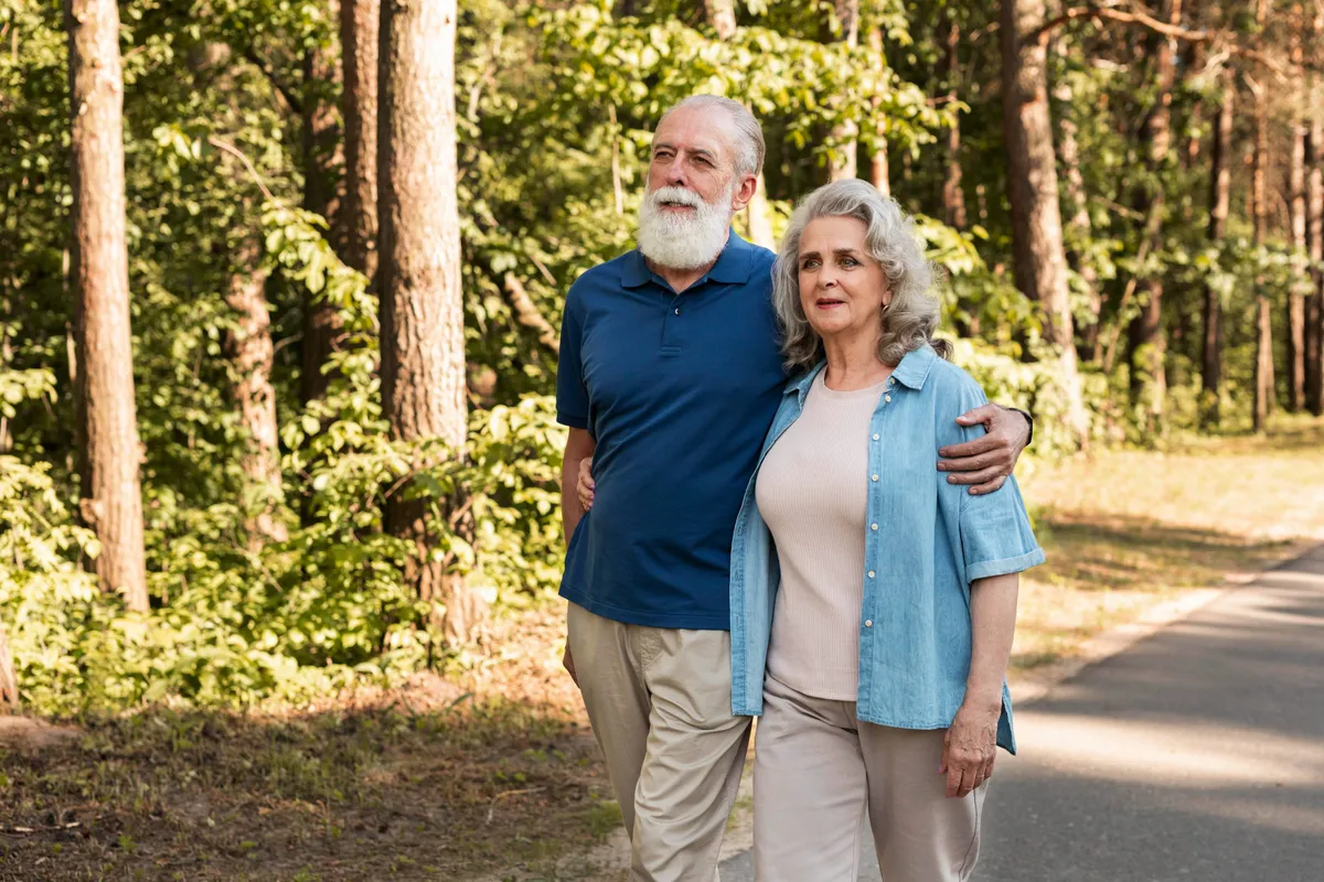 medium shot senior couple walking together