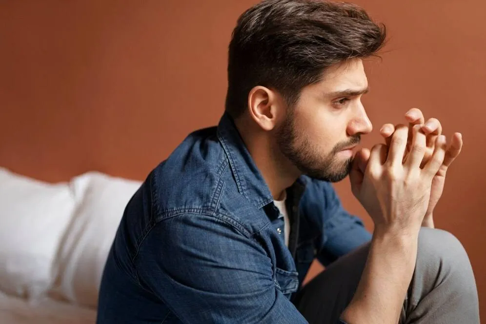 insecure man indoors side view 23 2149837699