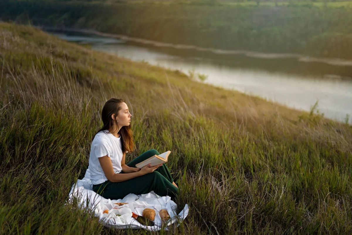 full-shot-woman-reading-nature