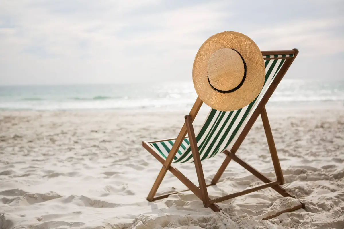 straw-hat-kept-empty-beach-chair (1)