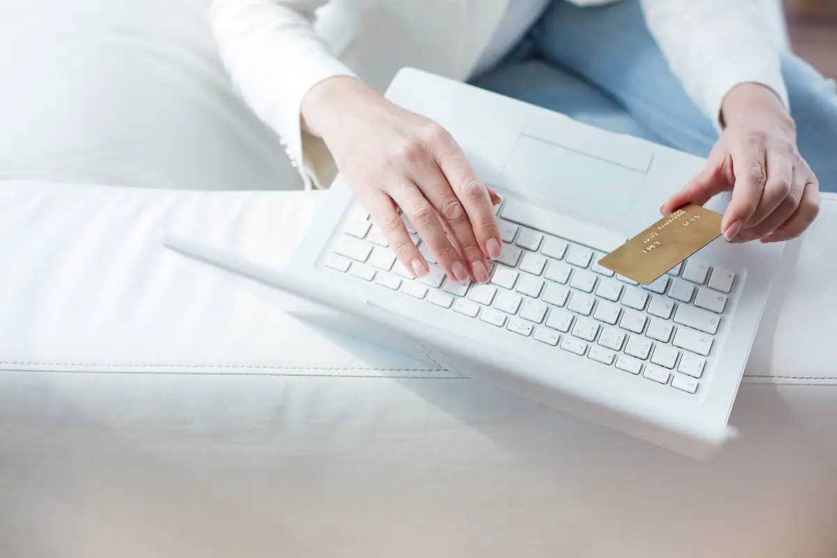 close-up-female-hands-making-online-payment