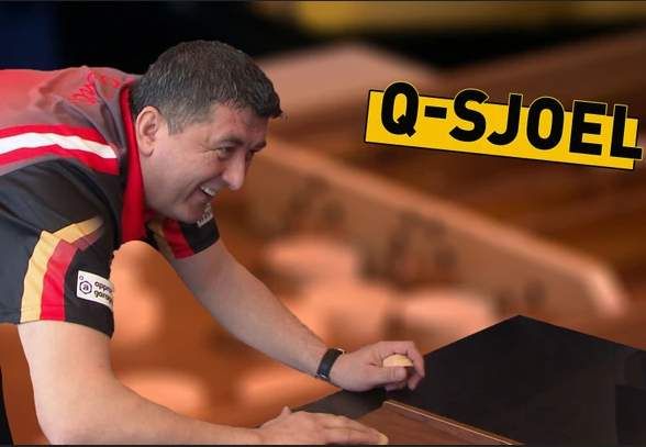 Mensur Suljovic in actie aan sjoelbak bij het RTL7-spel Q-Sjoel