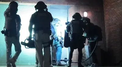 Drie mannen aangehouden voor wapenhandel tijdens invallen in Goirle en Tilburg