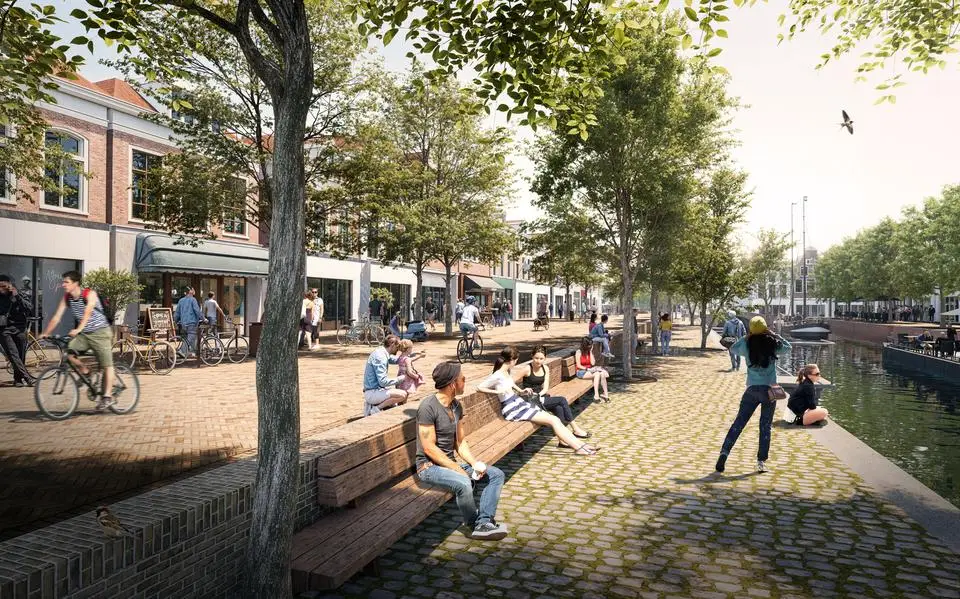 Nieuwestad in Leeuwarden krijgt klinkers met warme tint en een lage kade met zitplek langs gracht, fietsenstalling onder Costes