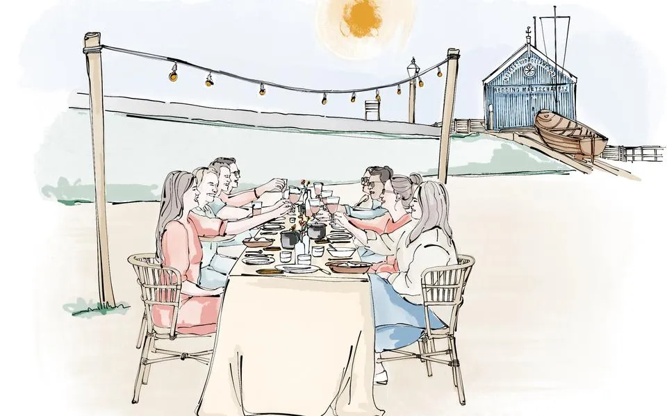 Een koksfeestje in de tuin. Lange buitentafels, eindeloos kletsen en heerlijk dineren op een zwoele zomeravond