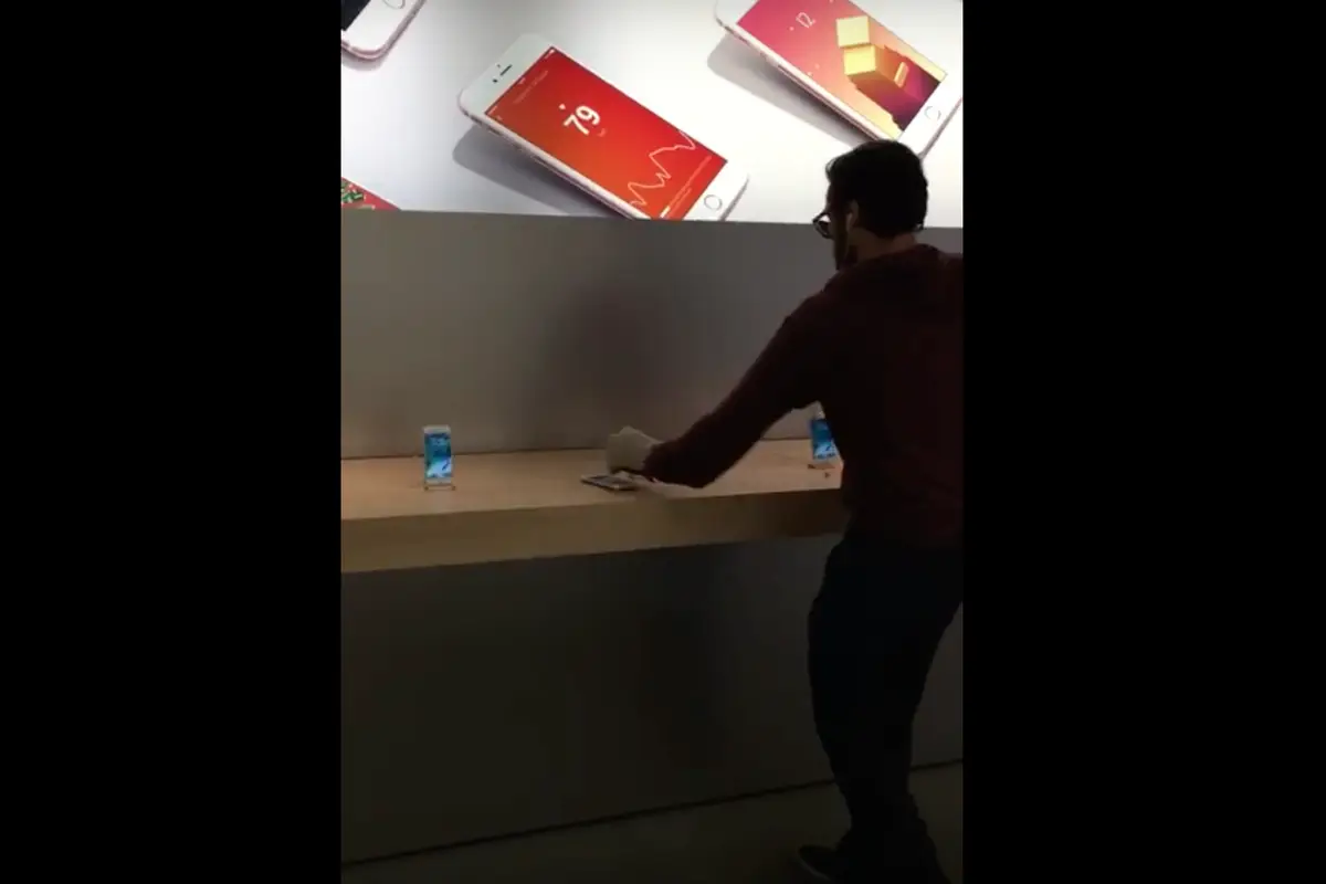 WATCH: Man smashes 14 iPhones, MacBook at store!