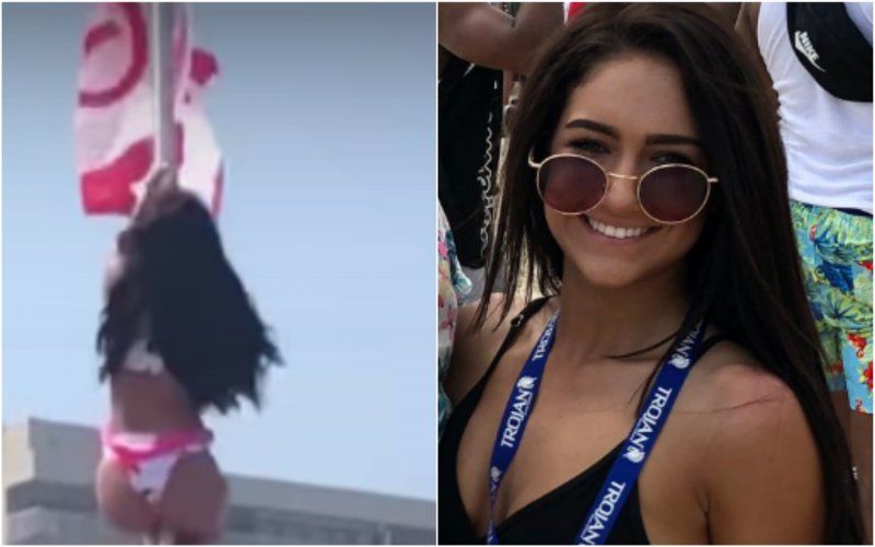 Bikinimeisje gaat aan vlaggenmast hangen, maar dan gaat het volledig mis (VIDEO)