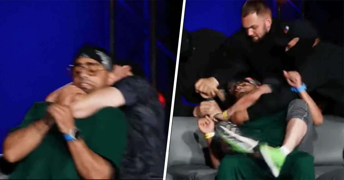 'Wat een gek!' Vechter bijna dood geknepen tijdens persconferentie (video)