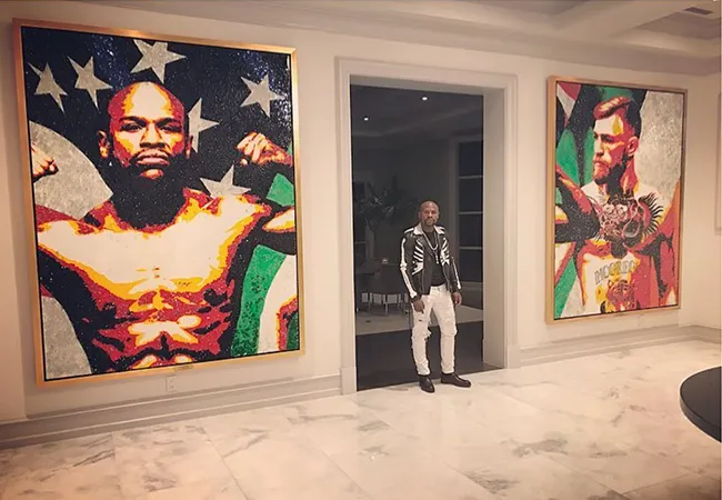 Mayweather heeft McGregor schilderij aan de muur hangen!