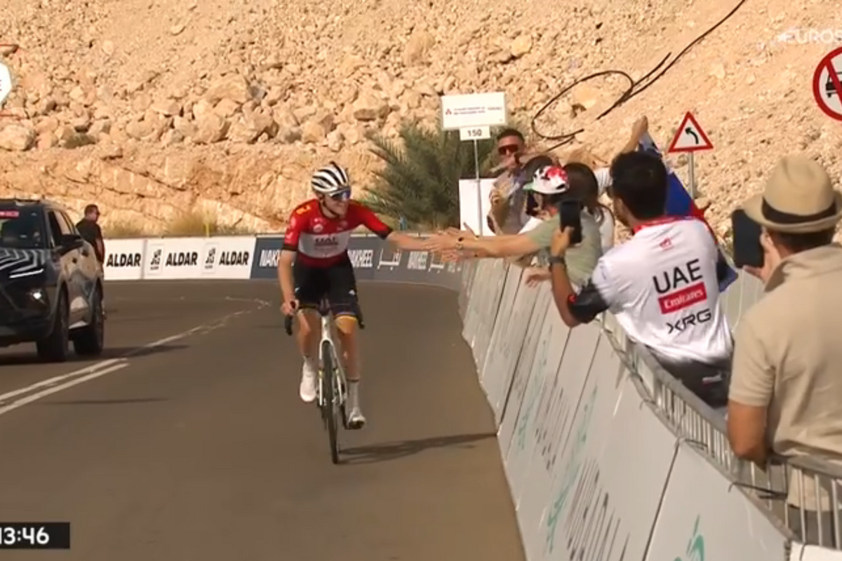 Behind the smiling Pogacar finishing his training, two happy riders make their mark on the UAE podium