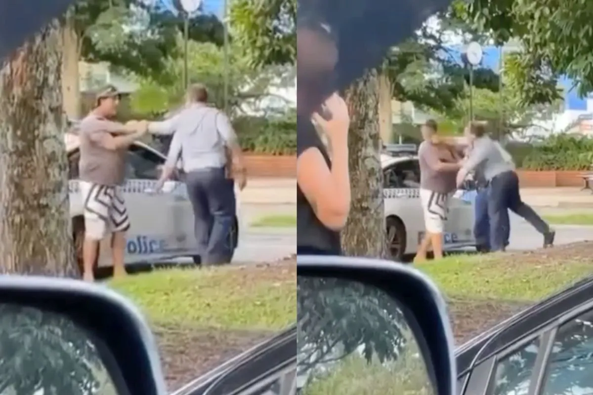 Agent deelt er even een uit aan Aussie die in zijn politieauto wil rondneuzen