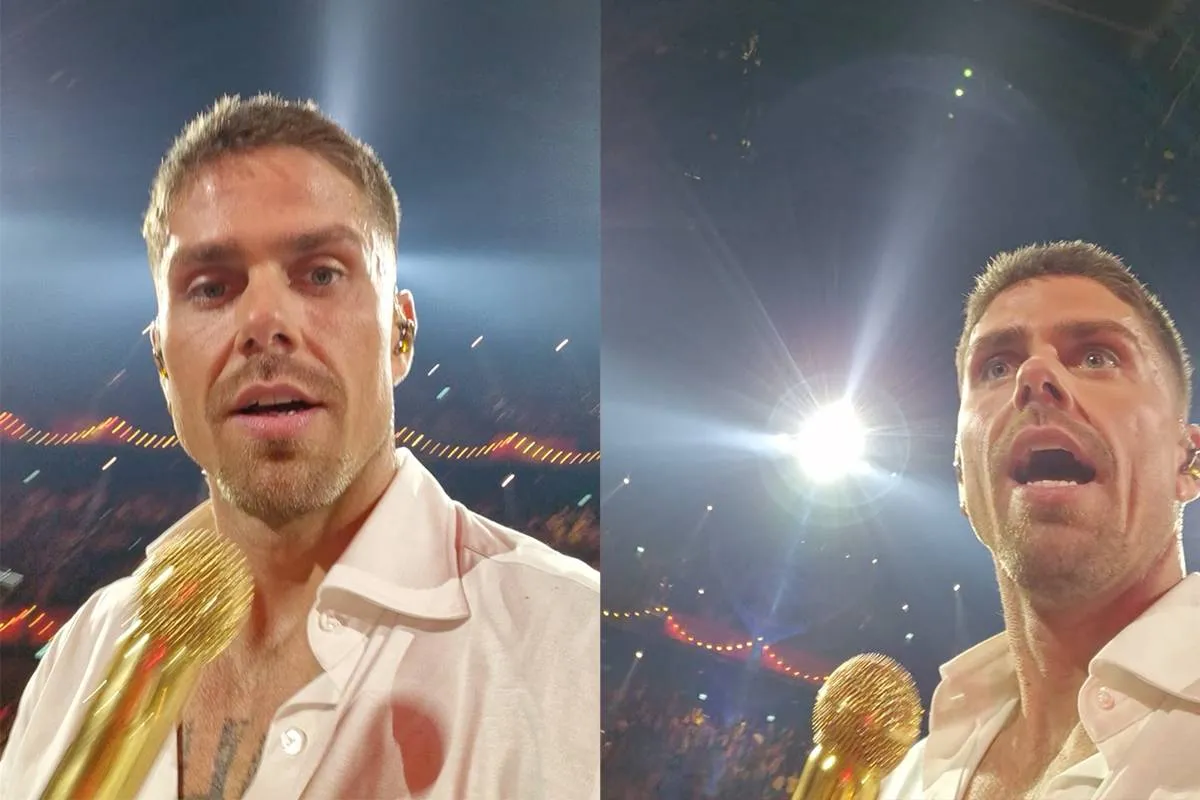Man gooit telefoon op podium tijdens 'Holland zingt Hazes', Andre Hazes pakt telefoon op
