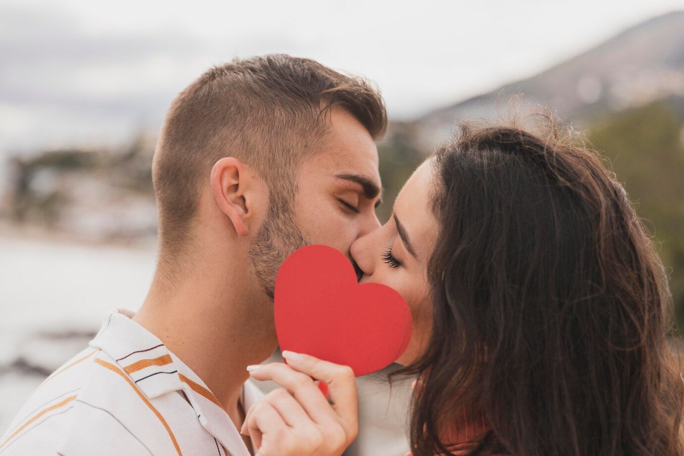 couple kissing with paper heart shape 23 2148518227