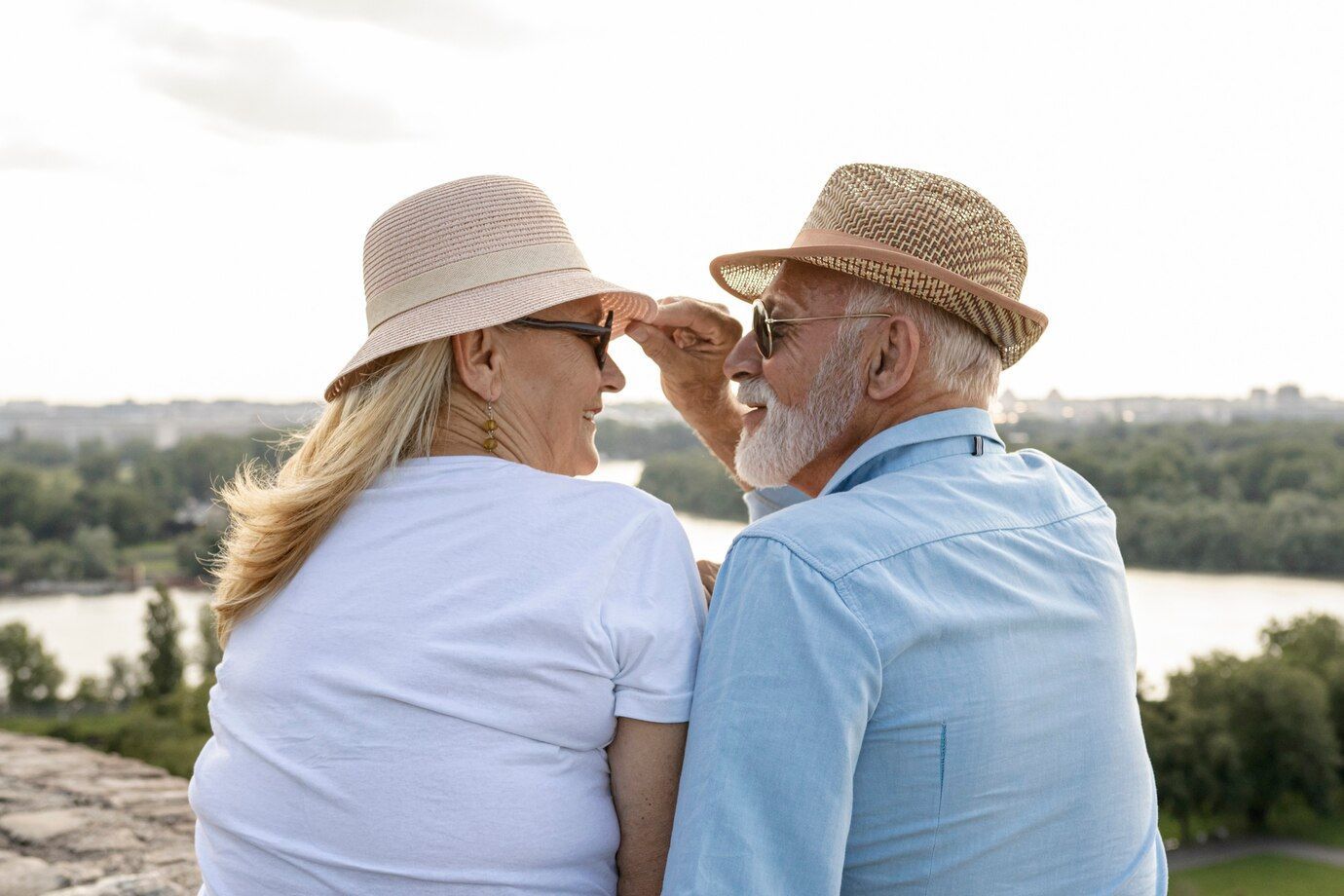 old man grabbing woman s hat 23 2148293951