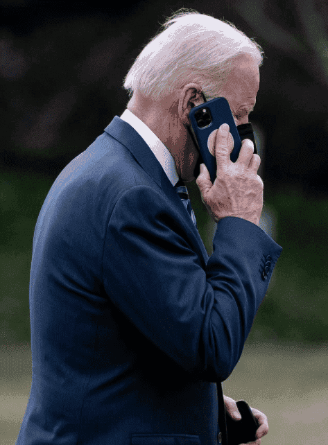 President Biden spotted using a “hush-hush” special iPhone with Presidential Shield