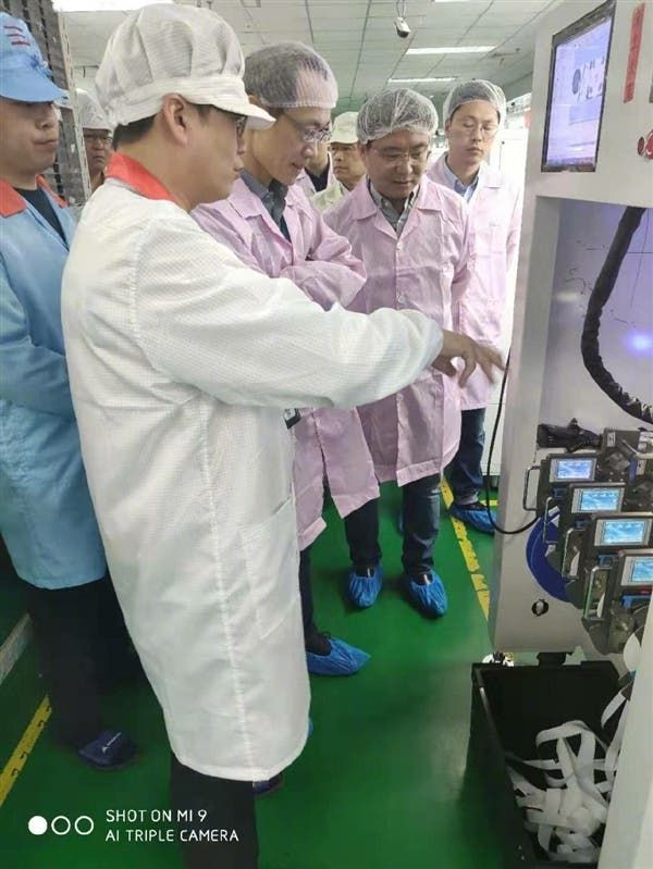 Lin Bin supervising Xiaomi Mi 9 Production