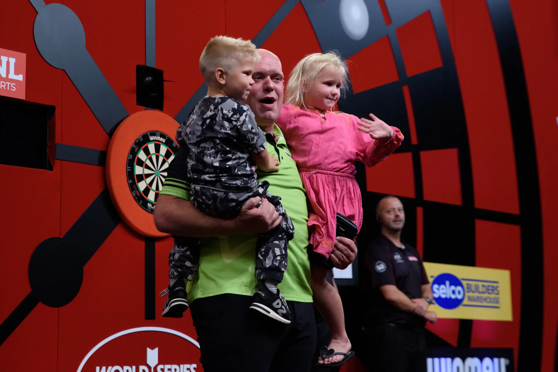 Van Gerwen's kids run on stage to celebrate after seeing dad win