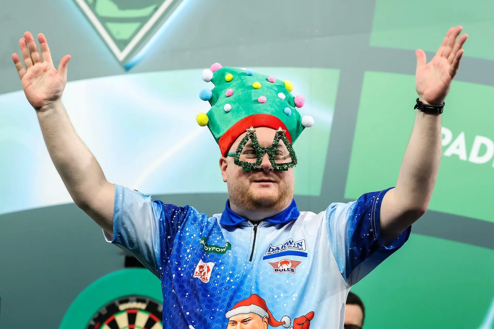 Ricky Evans brought the festive spirit to the World Darts Championship with a Christmas-themed walk-on