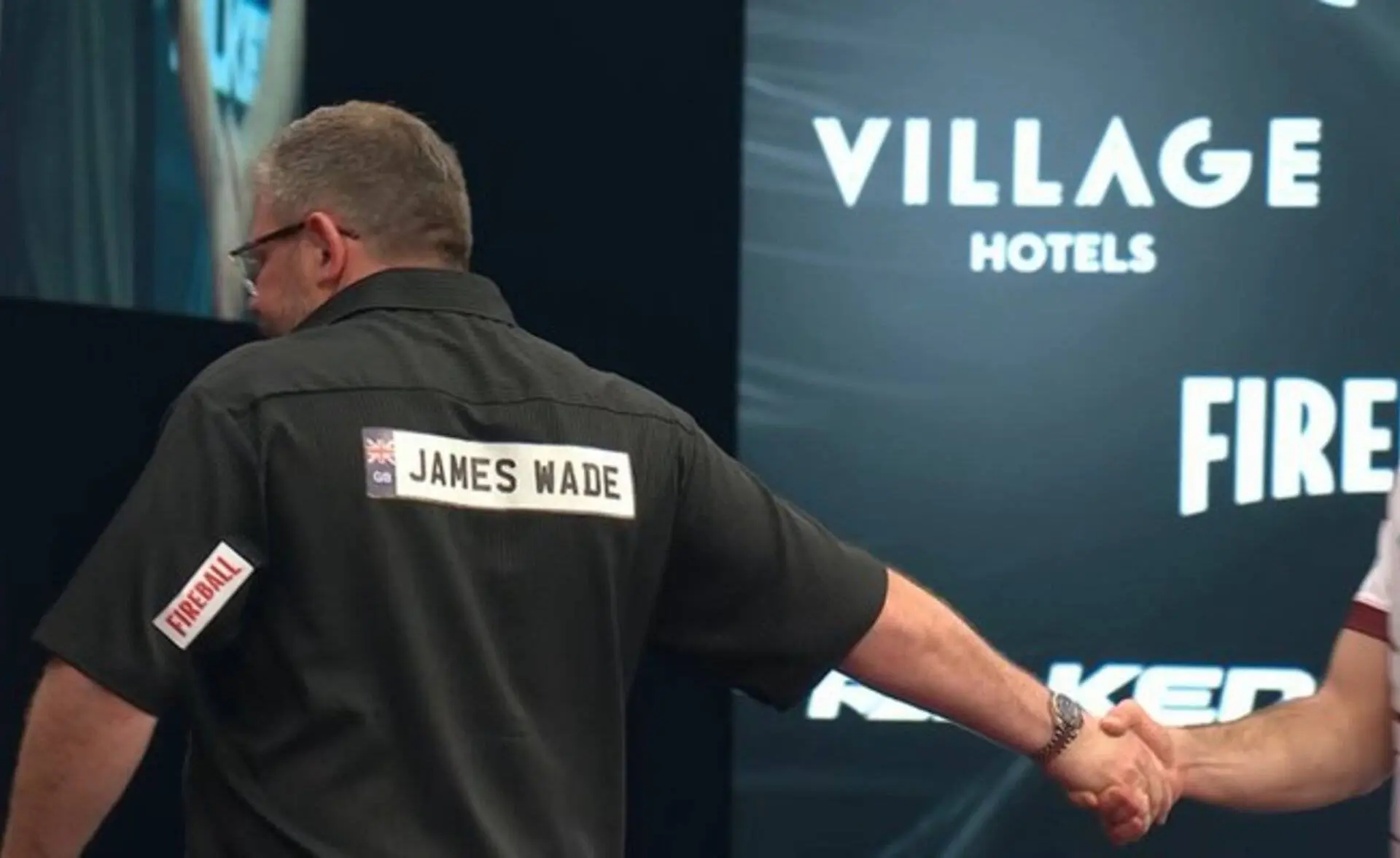 James Wade and Madars Razma share a frosty handshake after their match at the 2026 Winmau World Masters