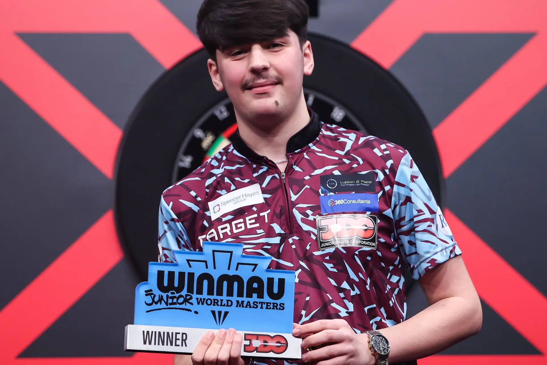 Stars of the future: 15-year-old Kaya Baysal denies fellow youth prodigy Mitchell Lawrie in Winmau Junior World Masters final