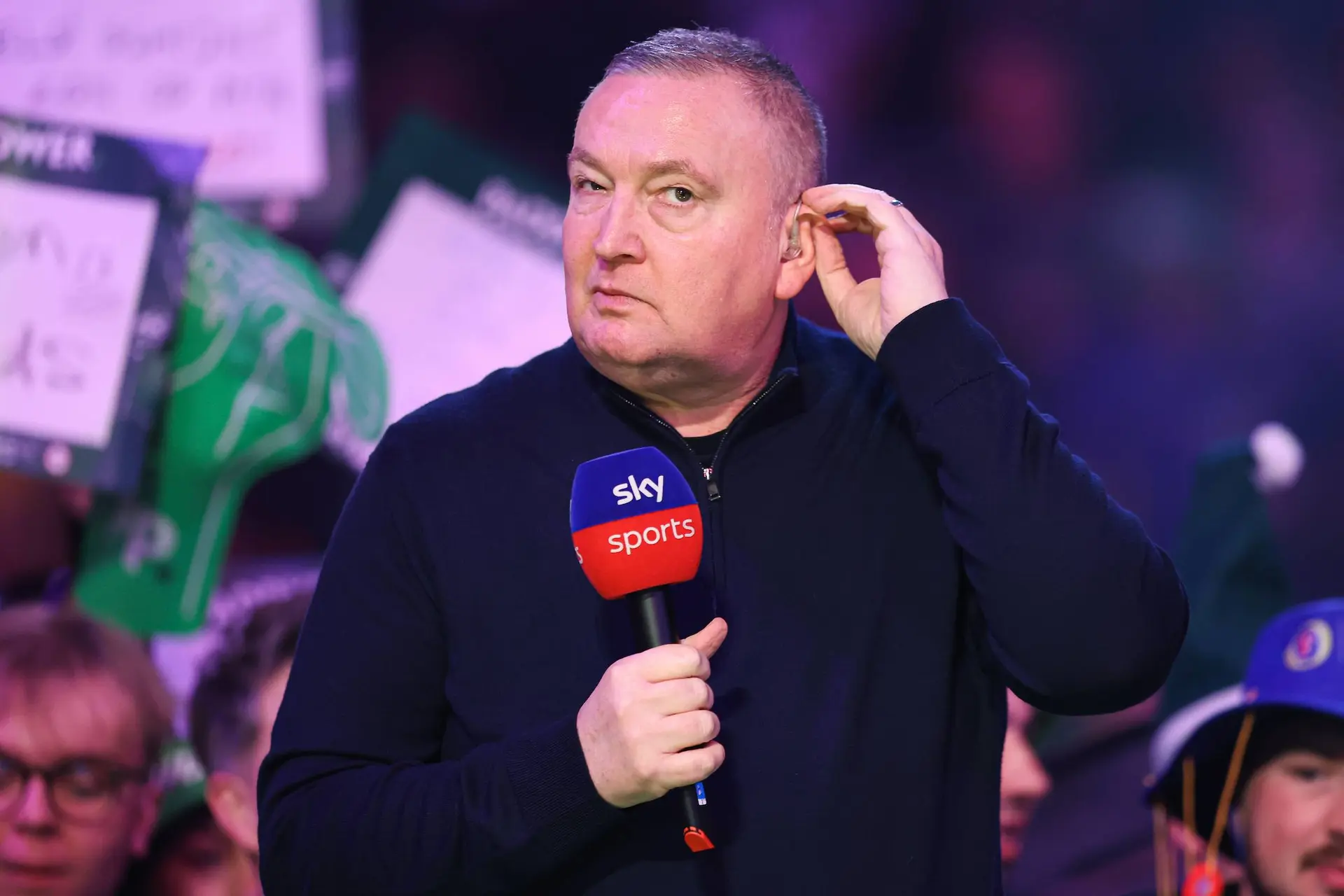 Glen Durrant holding a Sky Sports microphone