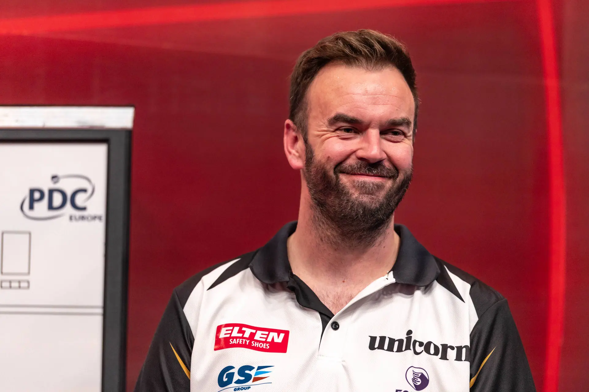 Ross Smith smiling on stage
